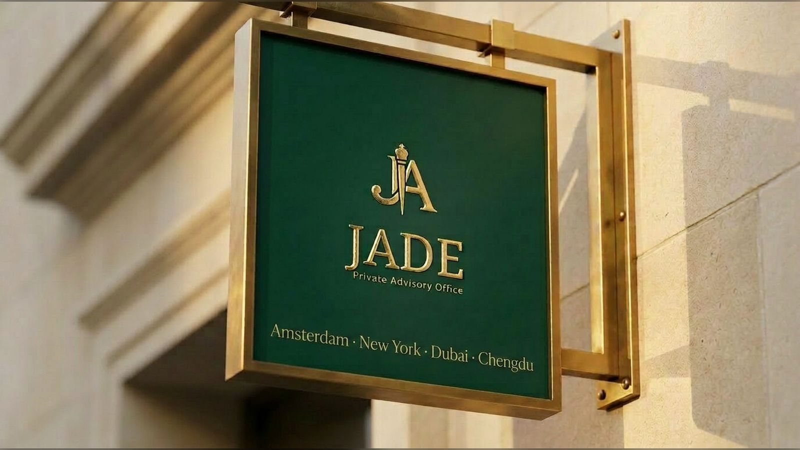 The jade green Jade Private Advisory Office sign hanging from a brass bracket on the limestone facade of the office, lit by late afternoon sun.